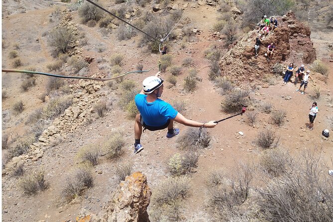 Climbing + Zipline + Via Ferrata + Cave. Adventure route in Gran Canaria - Volcanic Tube Cave: Speleology Starter, Darkness, and Belly-Crawl Reality