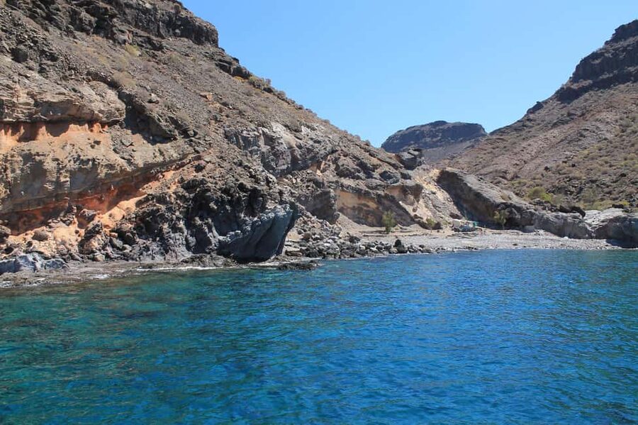 Explore Gran Canaria: Boat Tour with Wine & Food Tasting - Onboard vibes: deck time, beverages, and guide storytelling
