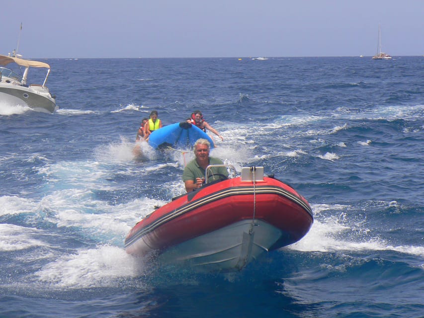 From Puerto Rico: Boat trip along the coast w/ Food & Drinks - Water Activities: Snorkeling, Optional Jetski, and Parasailing Add-Ons