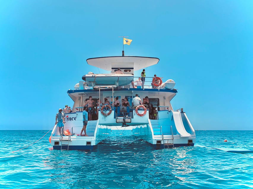 From Puerto Rico: Boat trip along the coast w/ Food & Drinks - Puerto Rico Departure, a Hop-On Style Stop, and Glass-Bottom Viewing