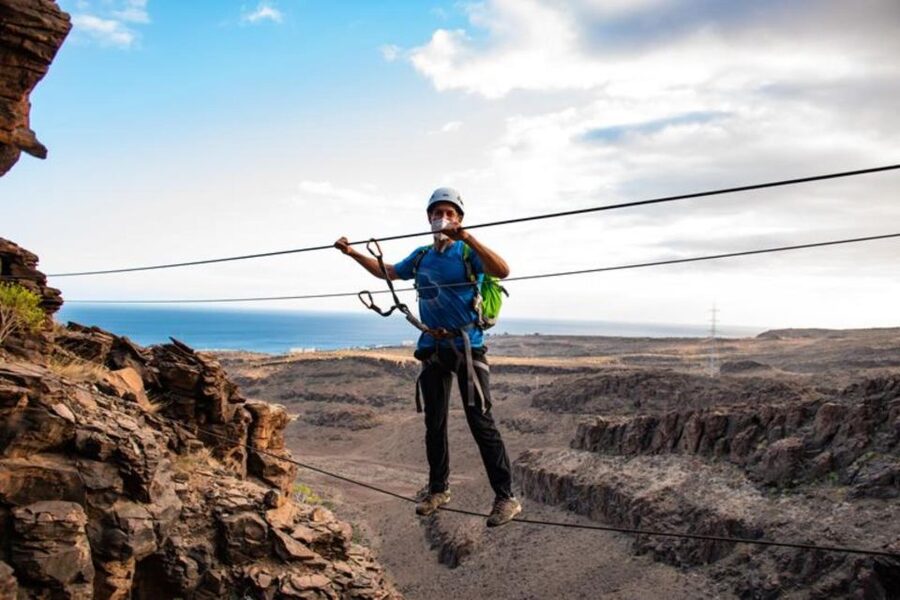 Gran Canaria: Cliff Climbing Via Ferrata Trip by Maspalomas - Entering the via ferrata: iron steps, a safety line, and guided technique
