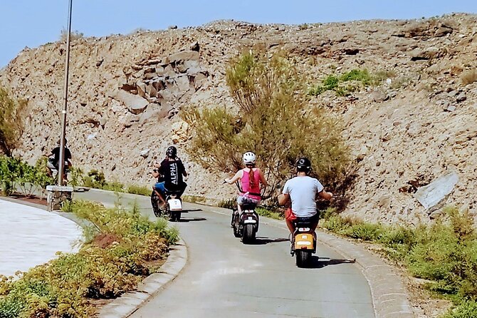 Maspalomas - Meloneras : e-Scooter 2 seat Sunset Guided Tour - Playa de las Meloneras: Volcanic Sand and a Blue Flag Beach Feel